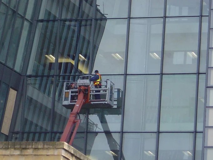 Commercial glass facade cleaned from a cherry picker in Adelaide